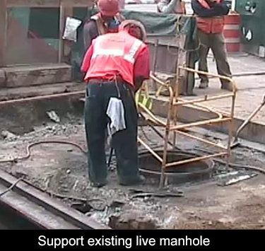 break out the existing live concrete manhole